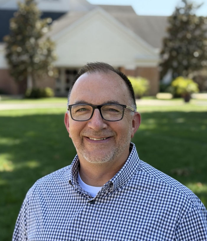 Professional headshot of Chad Mitchell.